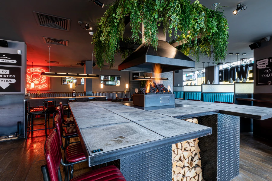 Fire retardent artificial foliage installed in restaurant above open fire
