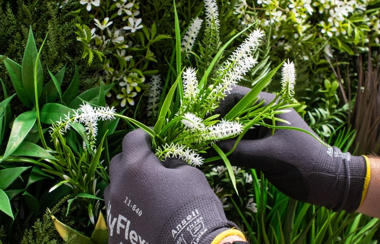 cleaning artificial plants with gloves on